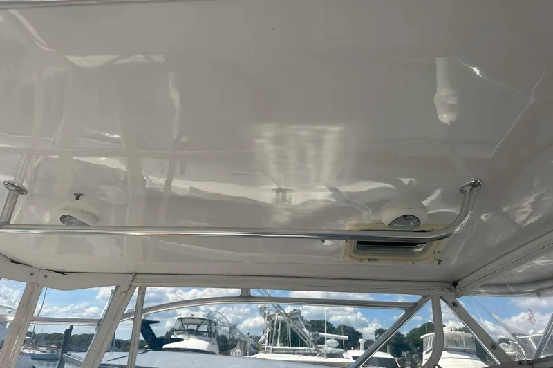 At Last 10 Yacht Photos Pics Interior view of 2017 Fortier F-30 Hardtop boat ceiling with lighting and window.