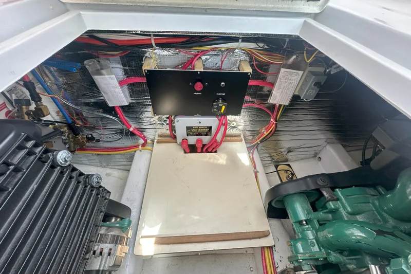 At Last 10 Yacht Photos Pics Engine compartment of a 2017 Fortier F-30 Hardtop with wiring and control panel.