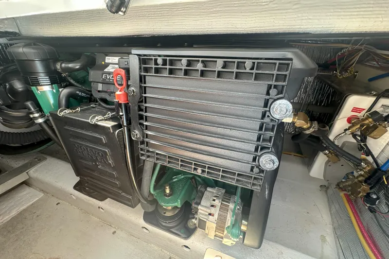 At Last 10 Yacht Photos Pics Engine compartment of a 2017 Fortier F-30 Hardtop boat, featuring Volvo Penta components.