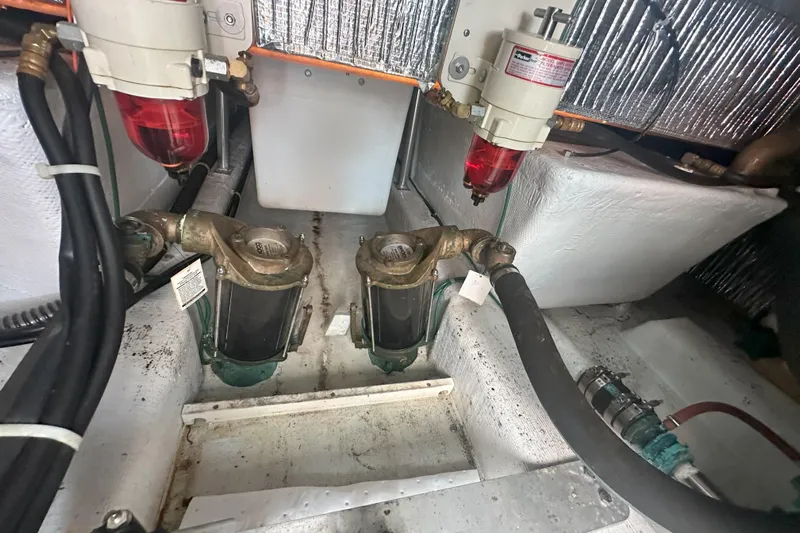 At Last 10 Yacht Photos Pics Engine room of 2017 Fortier F-30 Hardtop with fuel filters and hoses visible.