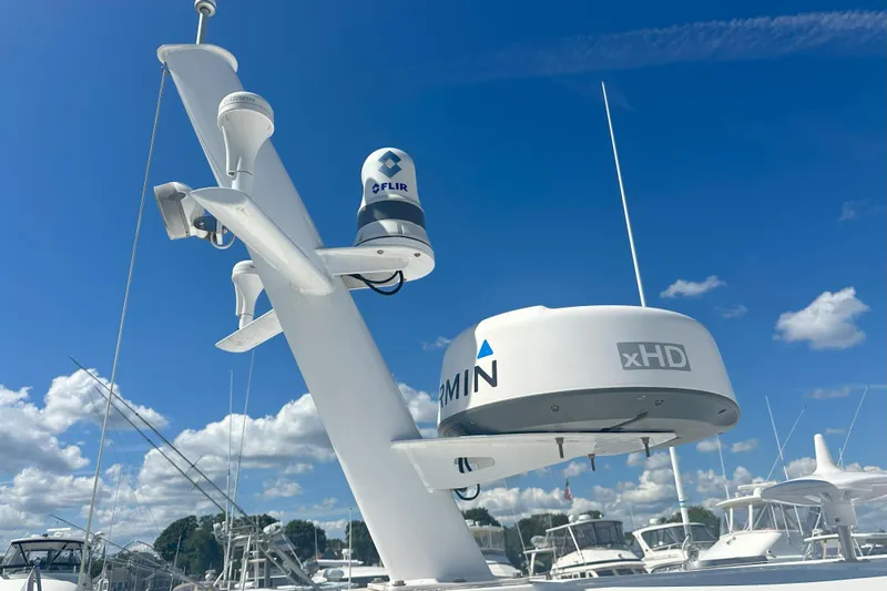 At Last 10 Yacht Photos Pics 2017 Fortier F-30 Hardtop with Garmin and FLIR equipment against a clear blue sky.