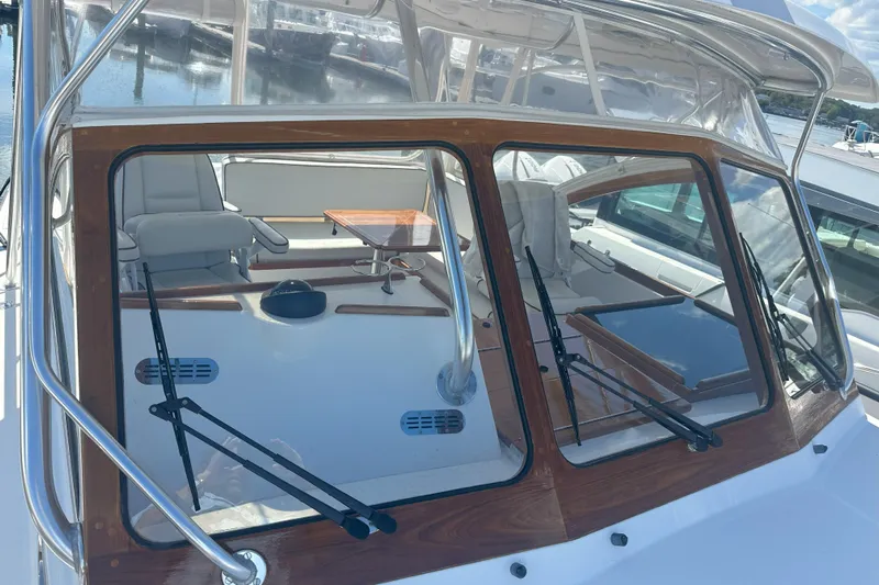 At Last 10 Yacht Photos Pics 2017 Fortier F-30 Hardtop boat with sleek design and spacious interior at marina.