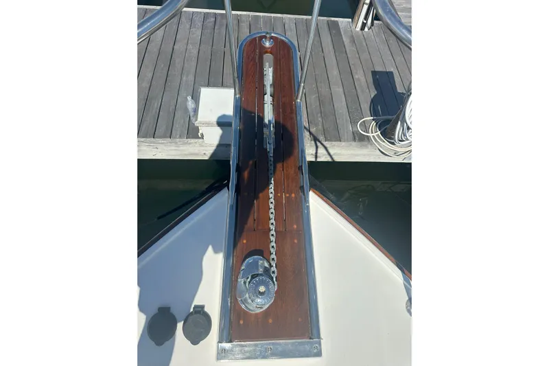 At Last 10 Yacht Photos Pics 2017 Fortier F-30 Hardtop boat deck with anchor chain and wooden finish.