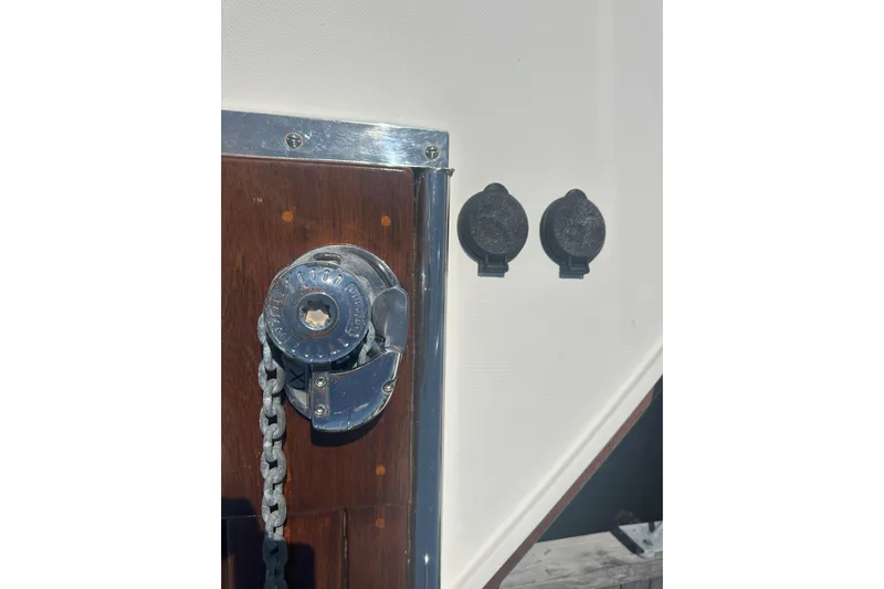 At Last 10 Yacht Photos Pics Close-up of 2017 Fortier F-30 Hardtop boat chain mechanism and fittings.