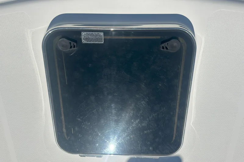 At Last 10 Yacht Photos Pics Hatch on 2017 Fortier F-30 Hardtop boat, featuring a sleek, reflective surface.