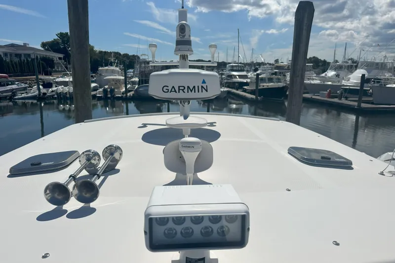 At Last 10 Yacht Photos Pics 2017 Fortier F-30 Hardtop boat with Garmin equipment at a marina.