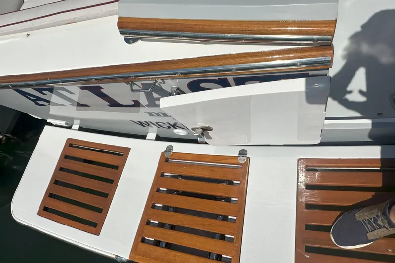 At Last 10 Yacht Photos Pics 2017 Fortier F-30 Hardtop boat with wooden deck details and shadow.