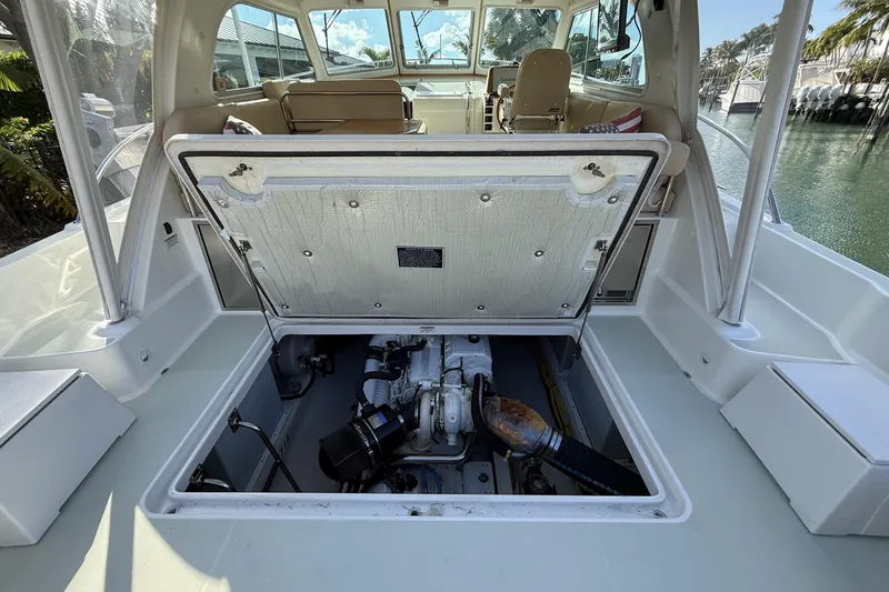 Never Say Never Again Yacht Photos Pics 2019 Back Cove Downeast 37 boat engine compartment with open hatch, dockside view.