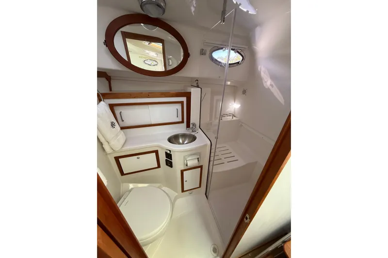 Never Say Never Again Yacht Photos Pics 2019 Back Cove Downeast 37 yacht bathroom with sink, toilet, and shower.