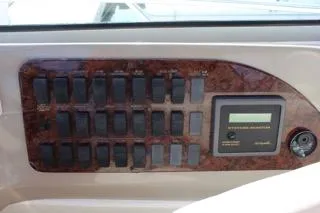  Yacht Photos Pics Control panel of a 2000 Sea Ray Sundancer boat with switches and a systems monitor.