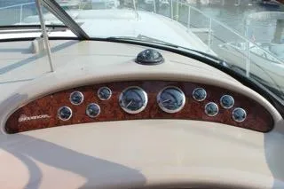  Yacht Photos Pics Dashboard of a 2000 Sea Ray Sundancer boat with gauges and compass.
