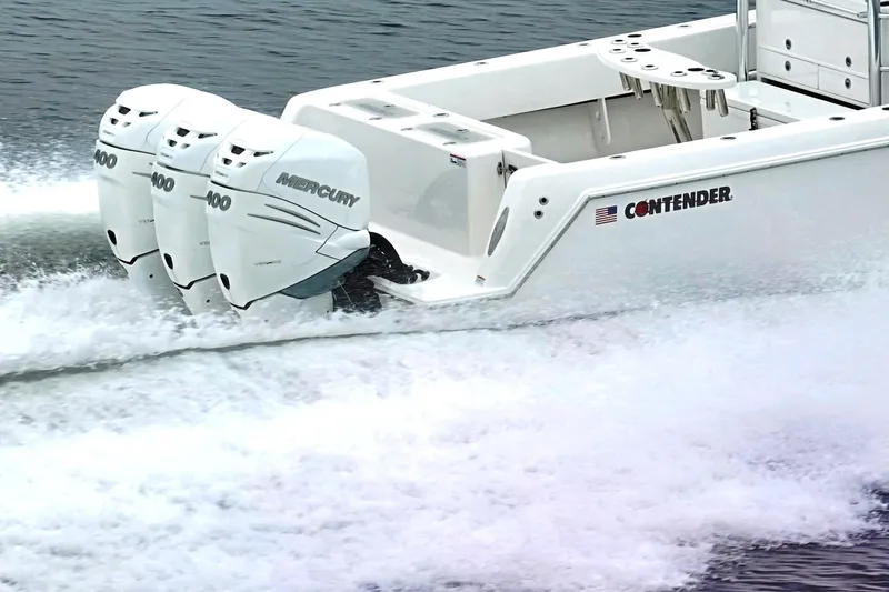 Yacht Photos Pics 2023 Contender 39 ST boat with triple Mercury engines speeding on water.