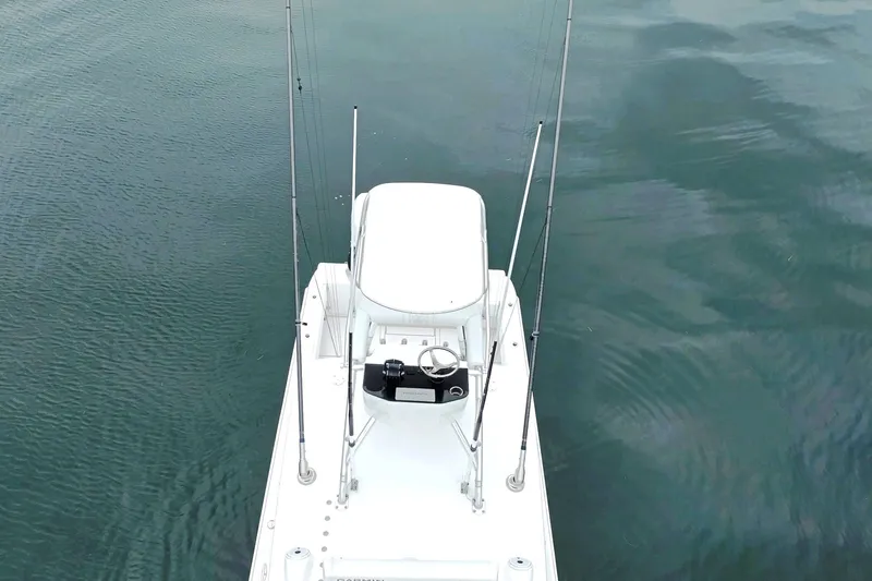  Yacht Photos Pics 2023 Contender 39 ST boat on calm water, aerial view.