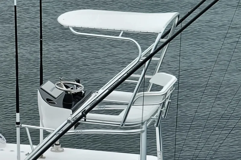  Yacht Photos Pics 2023 Contender 39 ST boat helm station with steering wheel and seating.