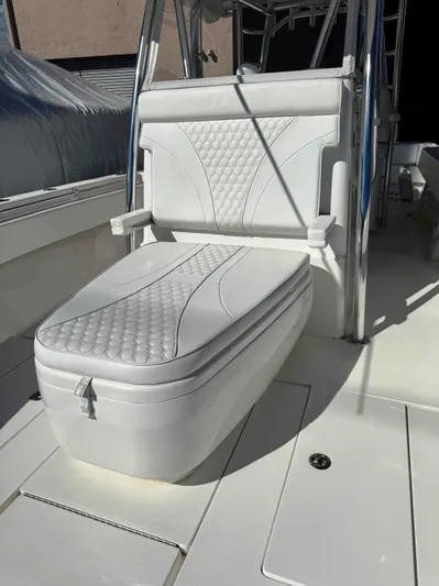  Yacht Photos Pics 2023 Contender 39 ST boat with white cushioned seating and sleek design.