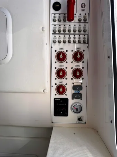  Yacht Photos Pics Control panel of a 2023 Contender 39 ST boat with switches and gauges.
