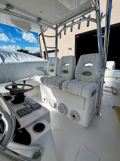  Yacht Photos Pics 2023 Contender 39 ST boat interior with plush seating and modern controls.