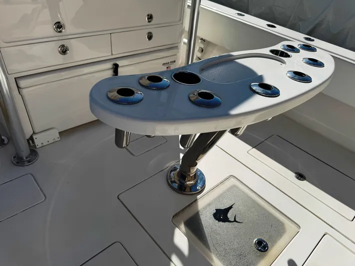  Yacht Photos Pics 2023 Contender 39 ST boat with rod holders and storage compartments.