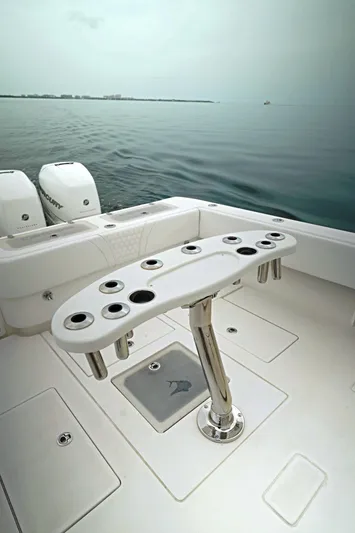  Yacht Photos Pics 2023 Contender 39 ST boat with rod holders, ocean view in background.