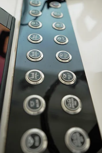  Yacht Photos Pics Control panel of 2023 Contender 39 ST boat with multiple buttons.