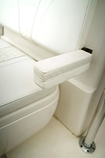  Yacht Photos Pics 2023 Contender 39 ST boat seat with white cushioned armrest.