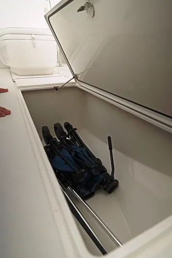  Yacht Photos Pics 2023 Contender 39 ST storage compartment with fishing gear inside.