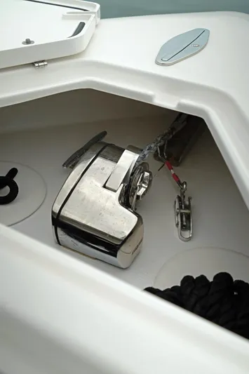  Yacht Photos Pics 2023 Contender 39 ST boat anchor compartment with stainless steel windlass and rope storage.