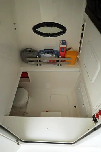  Yacht Photos Pics 2023 Contender 39 ST boat interior with storage and equipment.