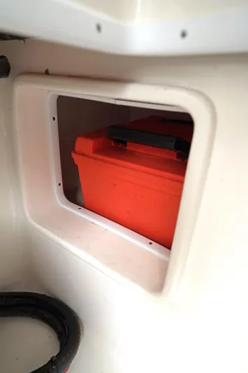  Yacht Photos Pics Orange storage box inside 2023 Contender 39 ST boat compartment.