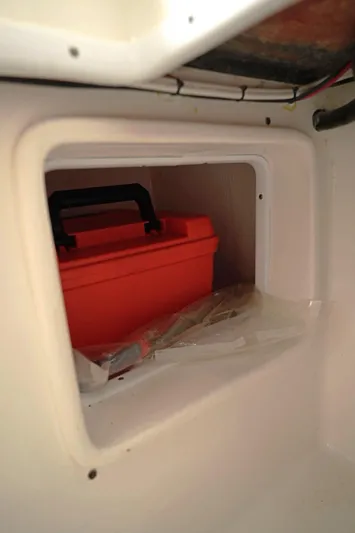  Yacht Photos Pics Storage compartment in 2023 Contender 39 ST boat with red toolbox inside.