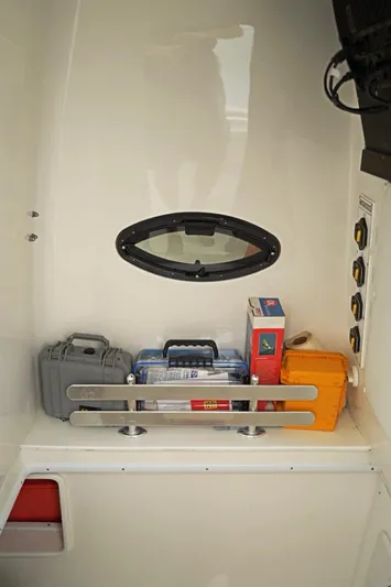  Yacht Photos Pics Storage area in 2023 Contender 39 ST boat with various equipment and supplies.