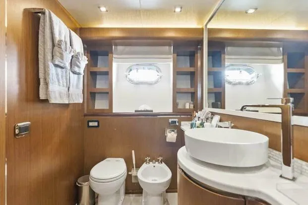  Yacht Photos Pics Luxurious bathroom on 2006 Tecnomar 35 Nadara yacht with modern fixtures and elegant design.