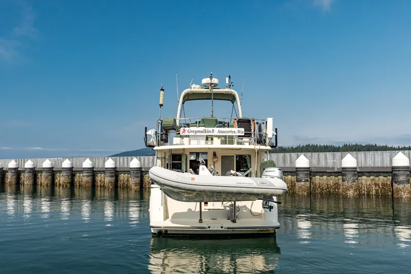 Greymalkin II Yacht Photos Pics 2008 North Pacific 39 Pilothouse yacht docked at a marina under clear blue skies.