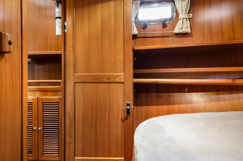 Greymalkin II Yacht Photos Pics Interior of 2008 North Pacific 39 Pilothouse with wooden cabinetry and window.