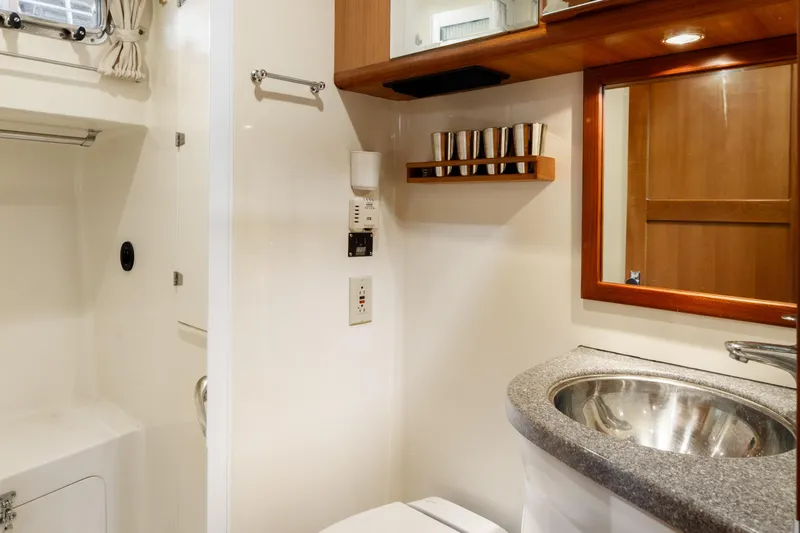 Greymalkin II Yacht Photos Pics Bathroom interior of 2008 North Pacific 39 Pilothouse yacht, featuring sink and mirror.
