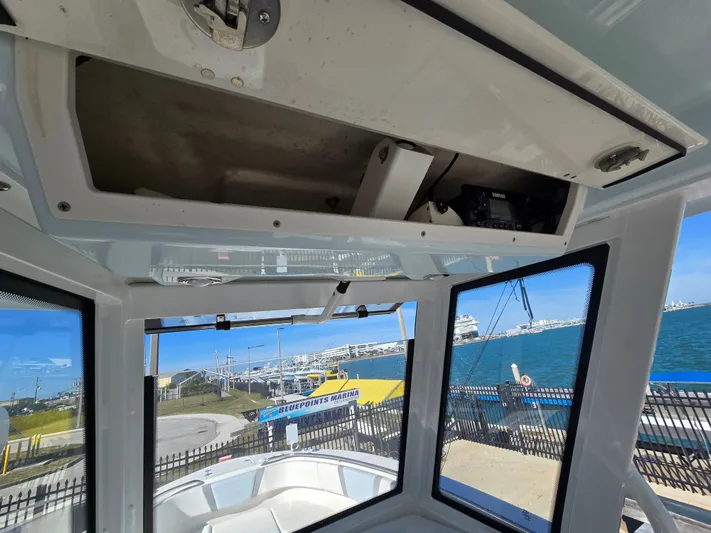 No Regrets Yacht Photos Pics Interior view of 2022 Robalo R272 Center Console overlooking marina.
