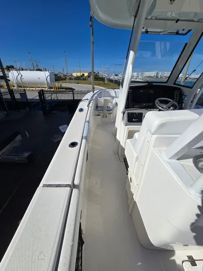 No Regrets Yacht Photos Pics Interior view of a 2022 Robalo R272 Center Console boat.