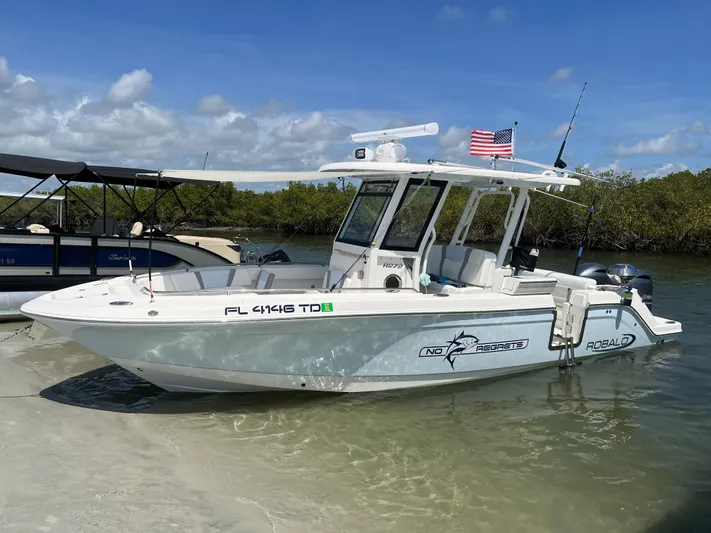 No Regrets Yacht Photos Pics 2022 Robalo R272 Center Console boat on the beach.