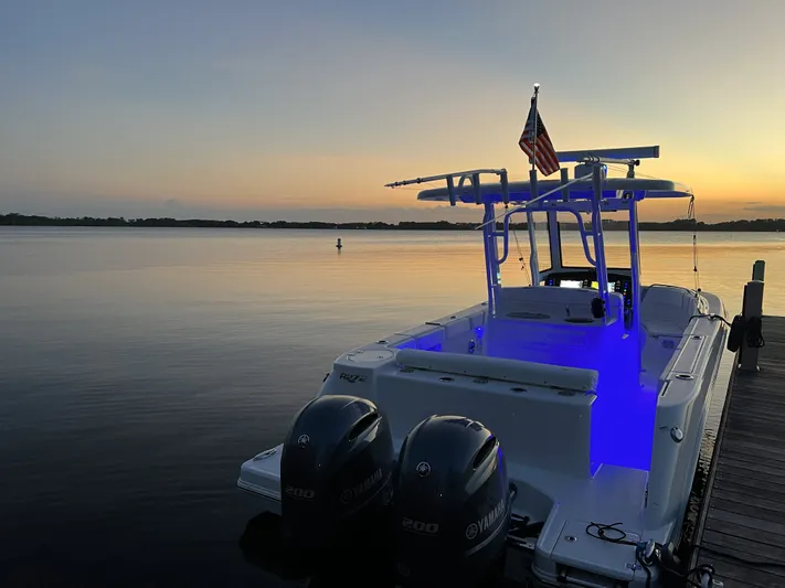 No Regrets Yacht Photos Pics 2022 Robalo R272 Center Console at sunset dock.