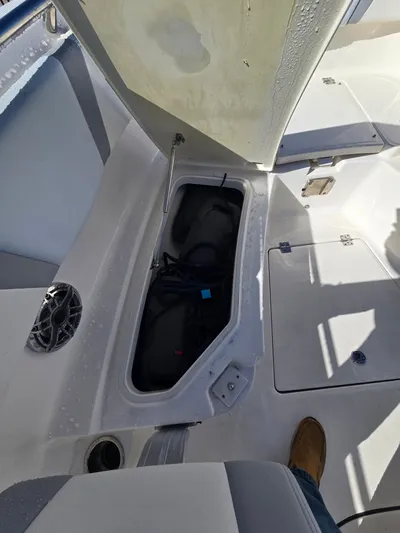 No Regrets Yacht Photos Pics 2022 Robalo R272 Center Console with open storage compartment.