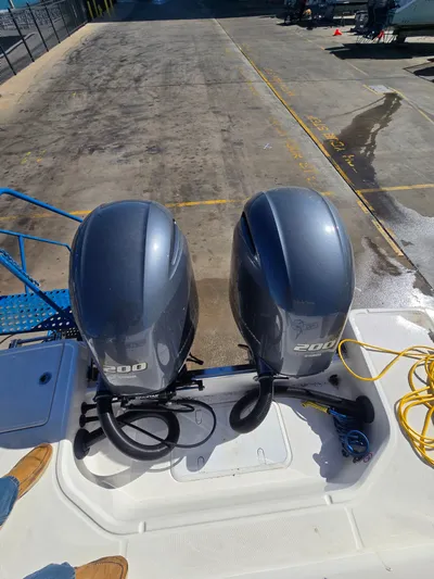 No Regrets Yacht Photos Pics Two outboard motors on a 2022 Robalo R272 Center Console boat.