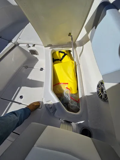No Regrets Yacht Photos Pics Storage compartment in Robalo R272 Center Console boat, 2022 model.