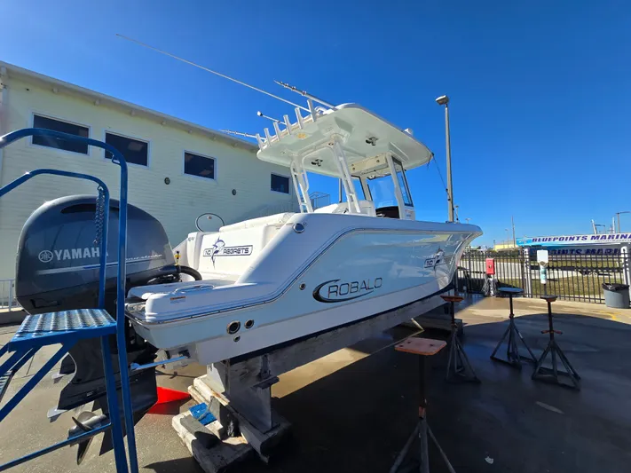No Regrets Yacht Photos Pics 2022 Robalo R272 Center Console boat on a dock.