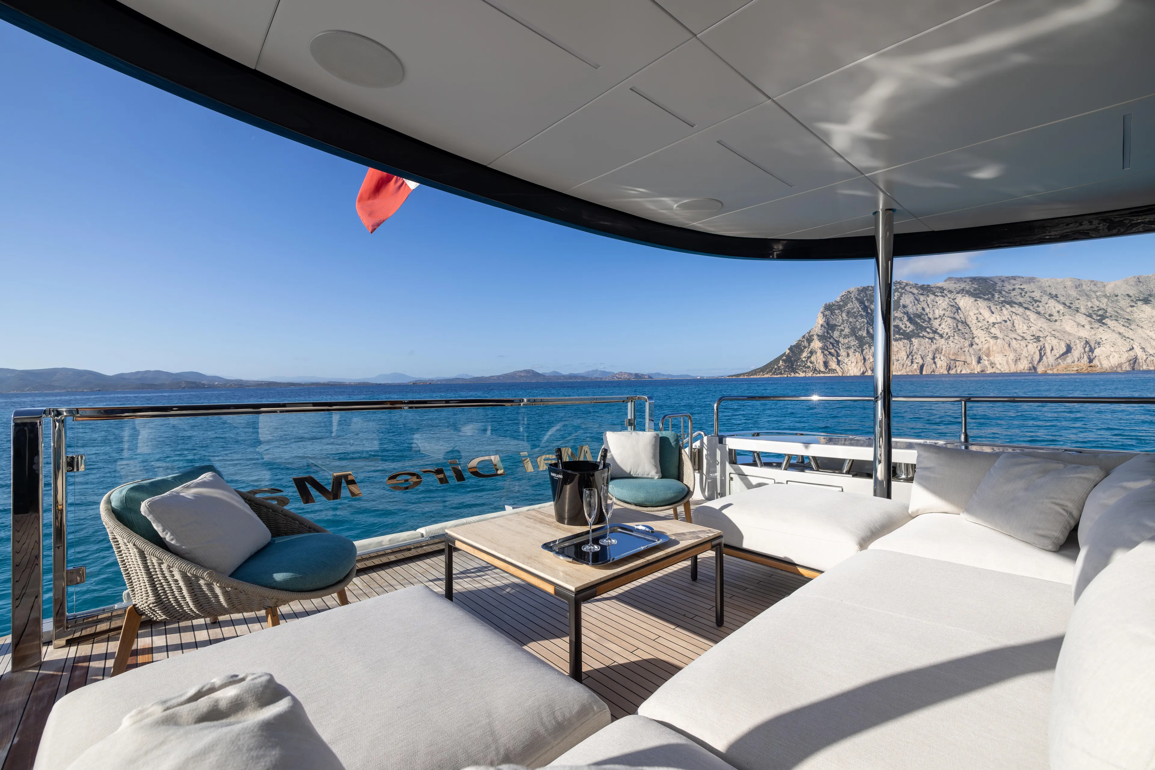 Filippetti F100 Yacht Photos Pics Luxurious 2026 Filippetti F100 yacht deck with ocean view and comfortable seating.