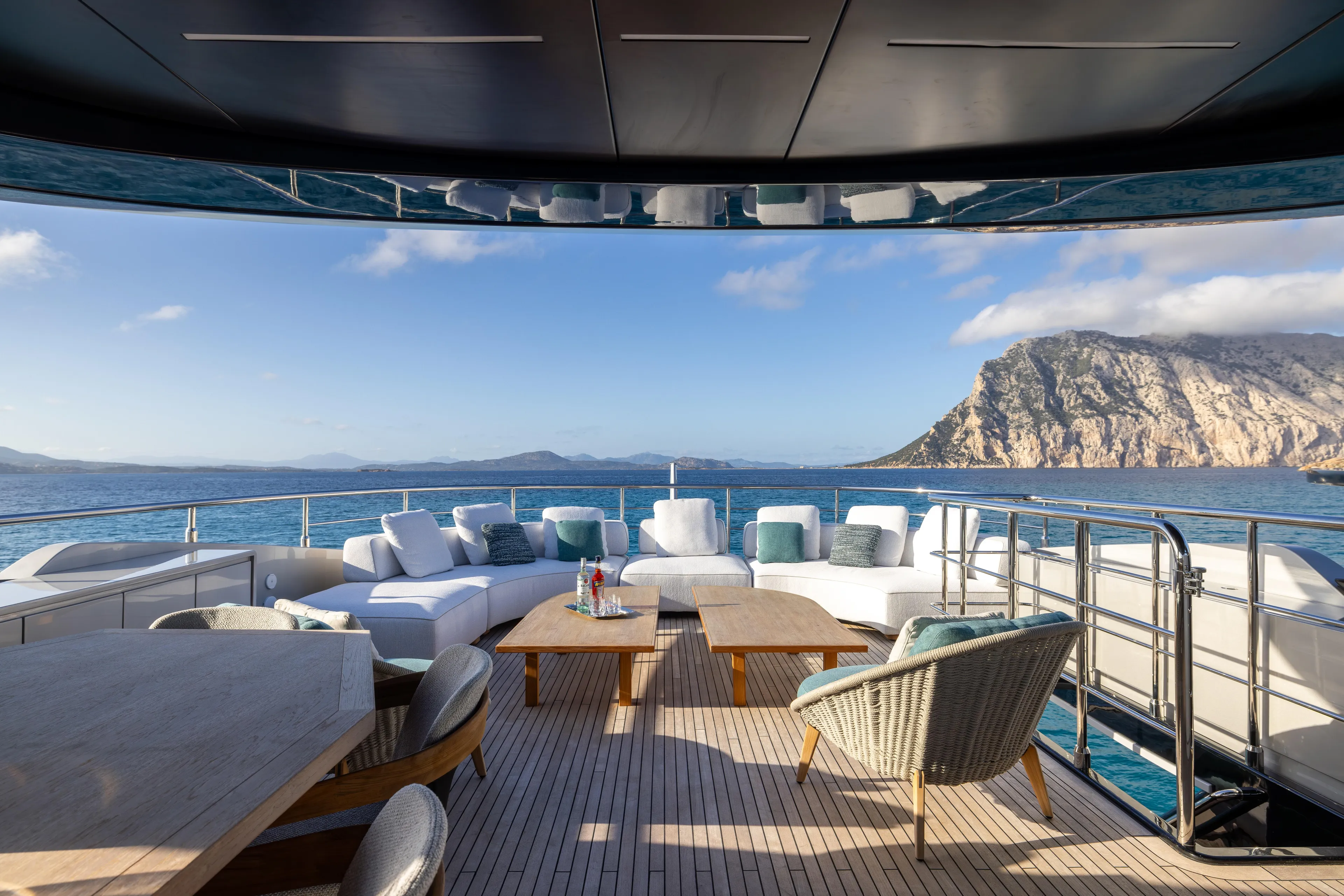 Filippetti F100 Yacht Photos Pics Luxurious Filippetti F100 yacht deck with ocean view, featuring elegant seating and scenic backdrop, 2026 model.