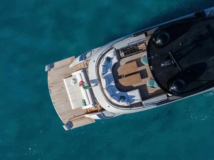 Filippetti F100 Yacht Photos Pics Aerial view of 2026 Filippetti F100 yacht on clear blue water.