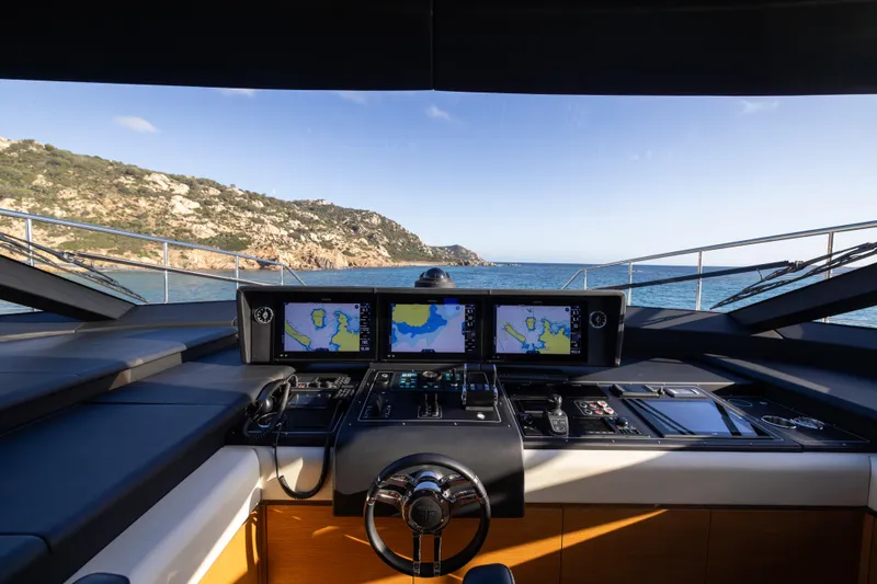 Filippetti F100 Yacht Photos Pics Helm of 2026 Filippetti F100 yacht with navigation screens, overlooking scenic ocean view.