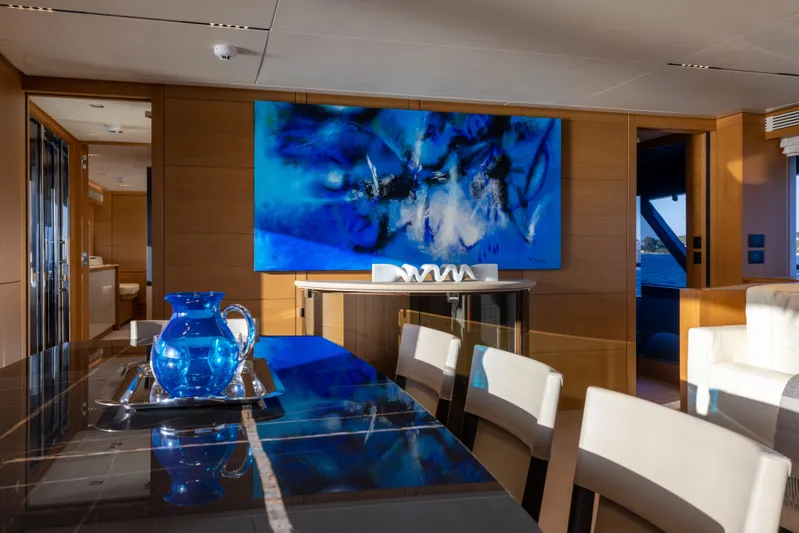 Filippetti F100 Yacht Photos Pics Luxurious interior of 2026 Filippetti F100 yacht with modern art and elegant dining setup.