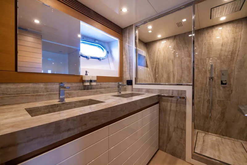 Filippetti F100 Yacht Photos Pics Luxurious bathroom in 2026 Filippetti F100 yacht with dual sinks and modern shower.