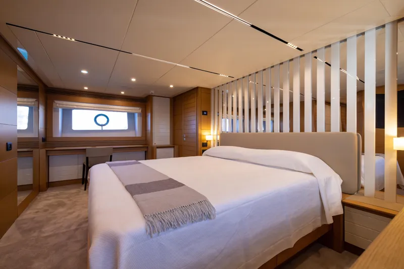 Filippetti F100 Yacht Photos Pics Luxurious bedroom interior of 2026 Filippetti F100 yacht, featuring modern design and elegant furnishings.